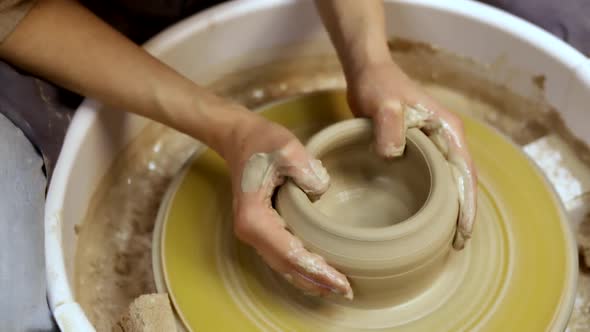 Making pottery on the potter's wheel