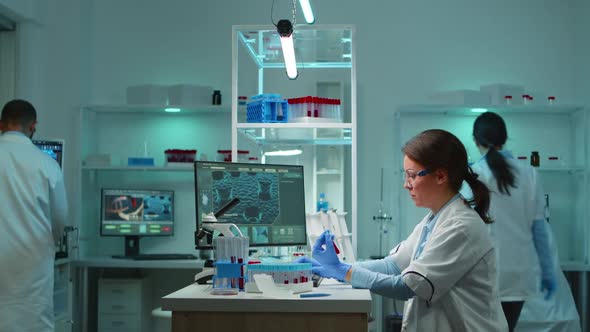 Medical Lab Worker Analyzing Blood Serum Conducting Virus Test