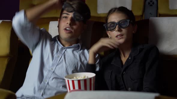 Man and Woman in the Cinema Watching a 3D Movie