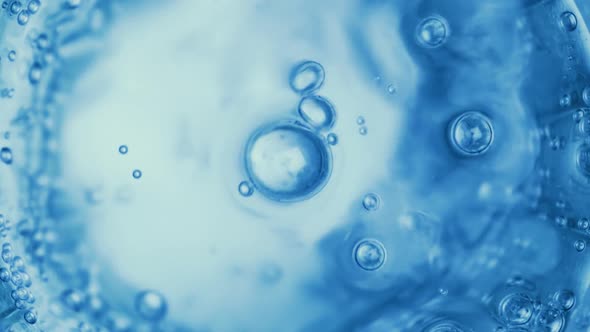 Oxygen Bubbles in Water on a Blue Abstract Background