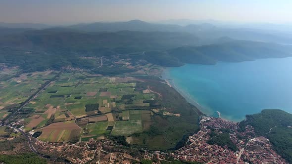 A Small City on a Forested Bay and Fertile Alluvial Plain by the Sea