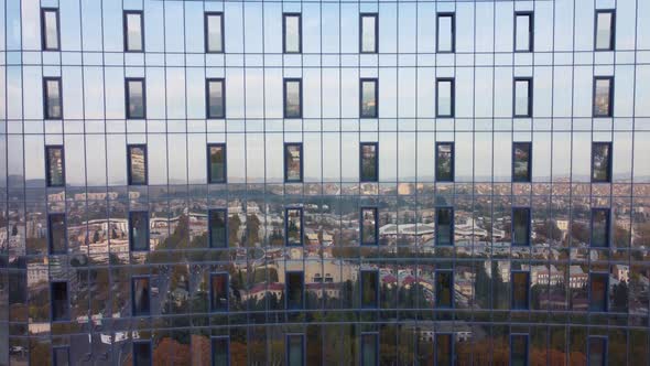 City Reflections On The Glass Building