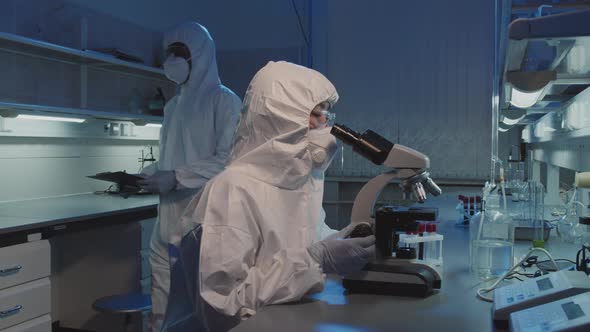 Female Epidemiologist Working in Lab and Posing