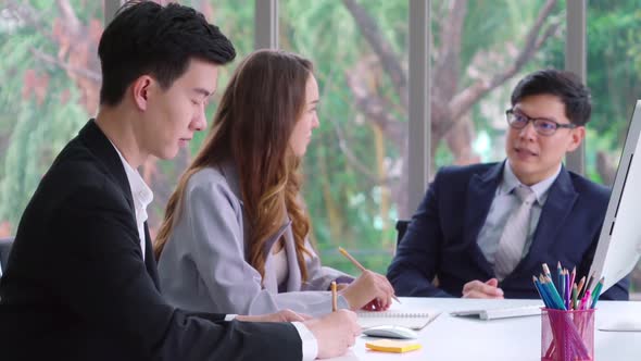 Smart Businessman and Businesswoman Talking Discussion in Group Meeting