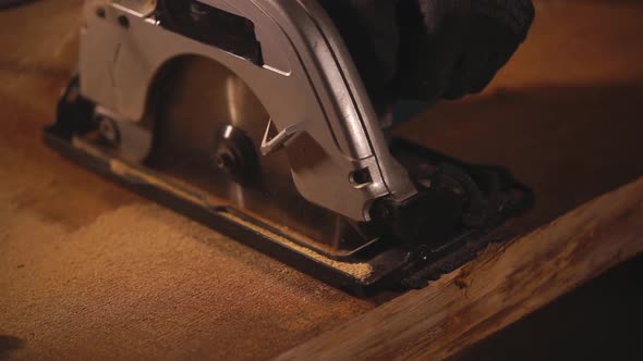 Cutting Through the Wood with a Saw