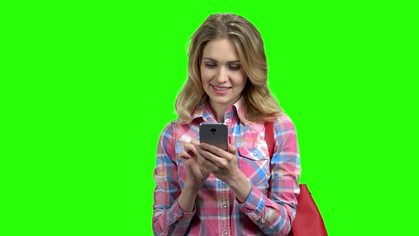 Happy Caucasian Woman Surfing the Internet with Phone