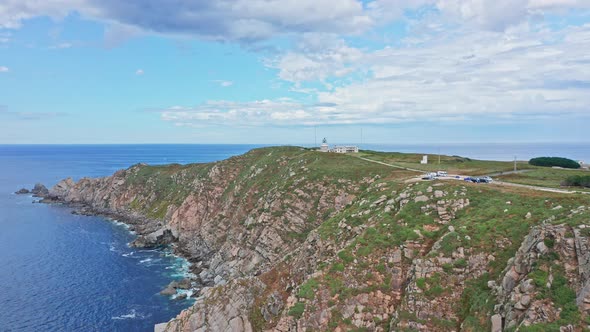 Aerial Top Notch fly above Estaca de Bares lighthouse in Galicia, North of Spain, cliff and sea view