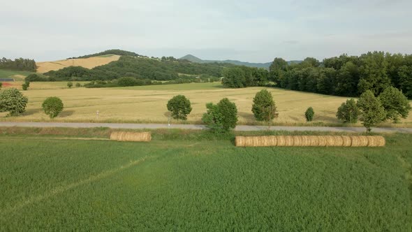 Aerial images of Tuscany in Italy cultivated fields summer,Green fields with mountains in the backgr