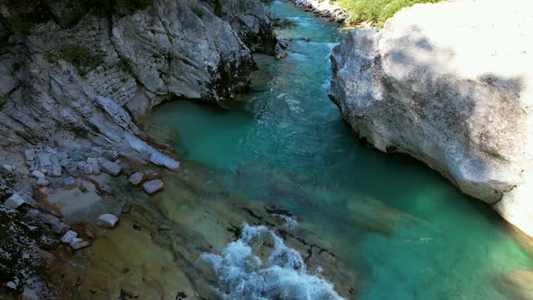 The Soča River in Slovenia, part of the Triglav National Park, has an emerald green color, and is on