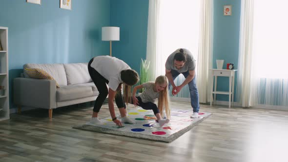 Happy Family Playing Indoor Game Together