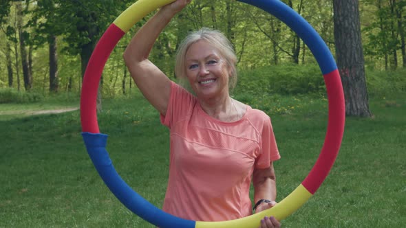 Fitness Lifestyle Health Concept Senior Mature Woman Portrait Holding Hula Hoop