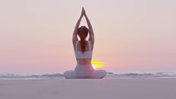 Young Asian lady warming up her hands with exercise