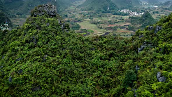 Aerial of the rock formations and towns along the Li River in China