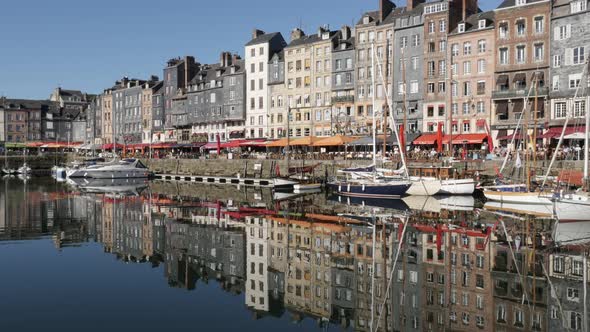 HONFLEUR, FRANCE - SEPTEMBER 2016 Beautiful colorful facades and water  reflections in  The Vieux Ba