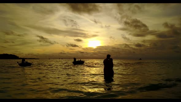 Man and woman suntan on beautiful tourist beach journey by transparent sea with bright sandy backgro