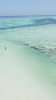 Tanzania  Vertical Video Kitesurfing Near the Shore of Zanzibar Slow Motion