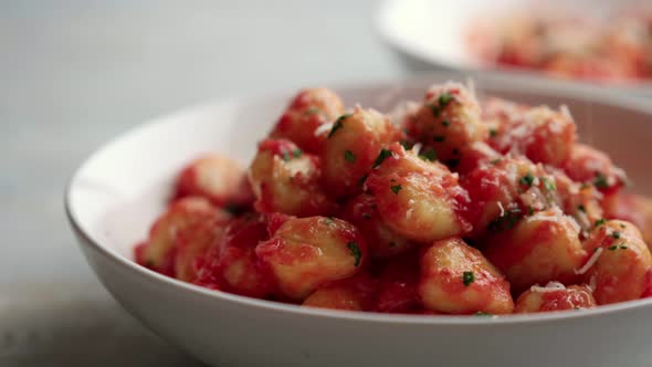 Gnocchi with Tomato Sauce and Parmigiano on a Plate