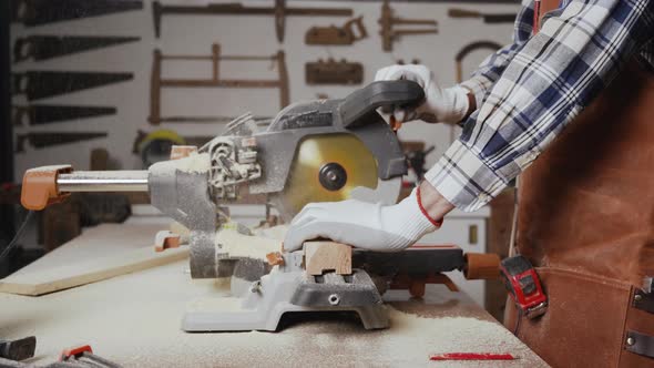 Carpenter Working At Workshop