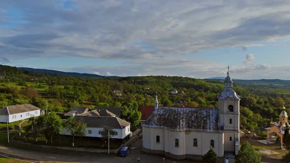 Beautiful Green Hills Covered with Church in Carpathian Mountains on Amazing a Small Village