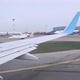 View of the Wing of the Plane That is Going to the Runway and the Airport From the Cabin of the - VideoHive Item for Sale