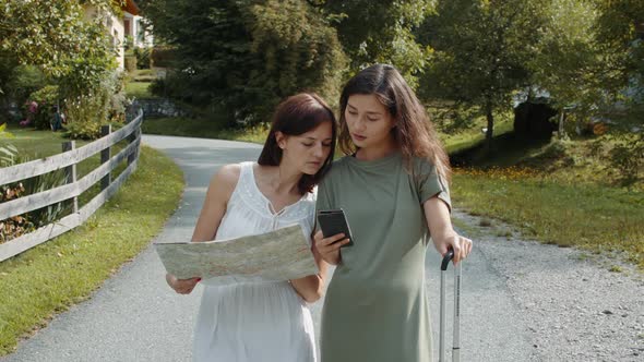 Travelers Girls Searching a Booking Address