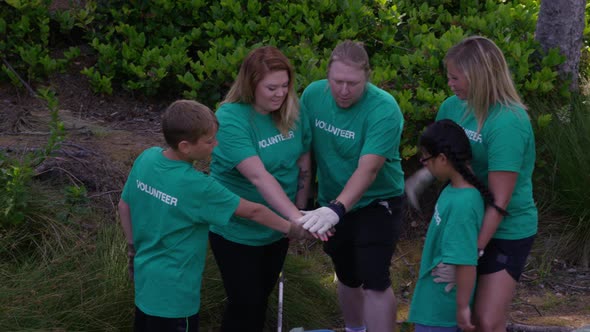 Group of volunteers cleaning up park