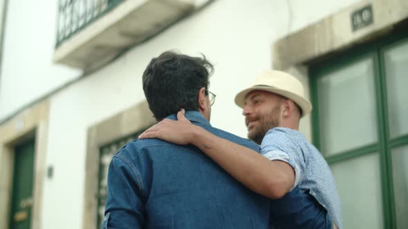 Handheld Shot of Happy Homosexual Men Walking and Hugging