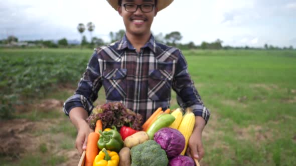 Farmers show organic vegetables as a product of their farms.