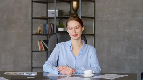 Listening woman looking at laptop computer, online conference distance office chat