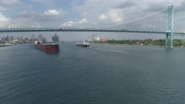 This video is of an aerial of large tanker ships in the Detroit river near downtown Detroit.