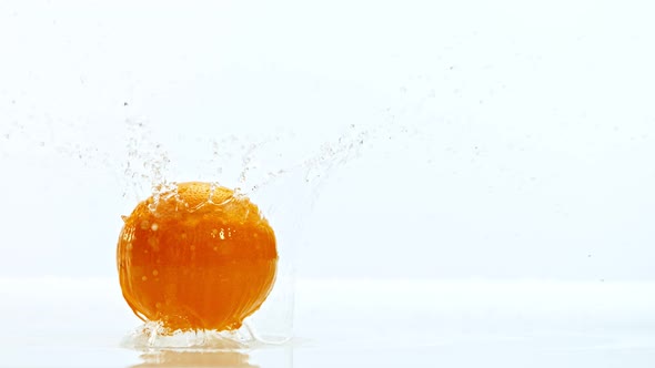 Fresh Orange Dropped Into Water with Splash Shooted with High Speed Cinema Camera at 1000 Fps