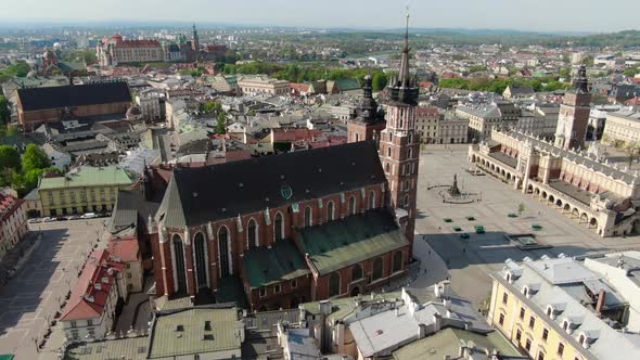 Flying over Main Square, Rynek Glowny in Krakow, Cracow city in Poland, Polska