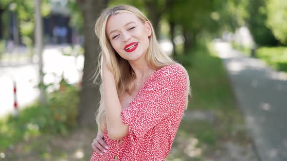 Smiling Woman in Red Dress