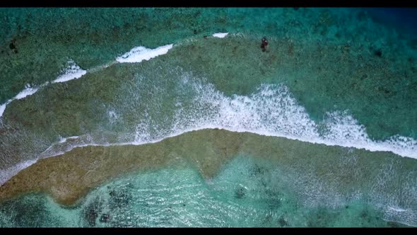 Aerial above seascape of relaxing coast beach adventure by clear ocean and white sand background of 