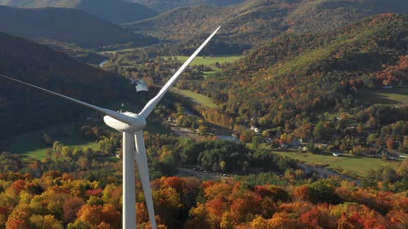 Windmill turbine wind farm aerial during beautiful autumn leaf season