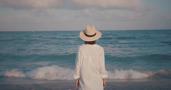 Young woman by the sea