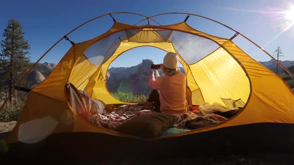 The Tourist Shoot with a Smartphone the View of the Half Dome Cliff Through the Window in the Tent.