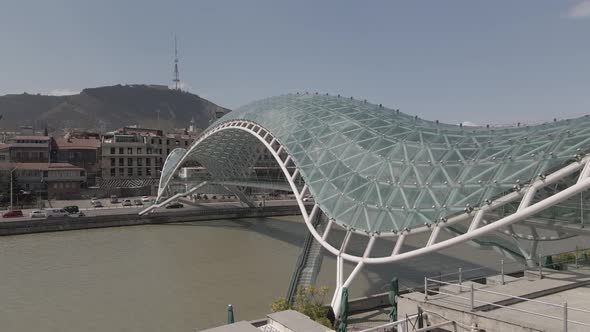 Tbilisi, Georgia - April 2 2021: Aerial view of Tbilisi city central park and Bridge of Peace.