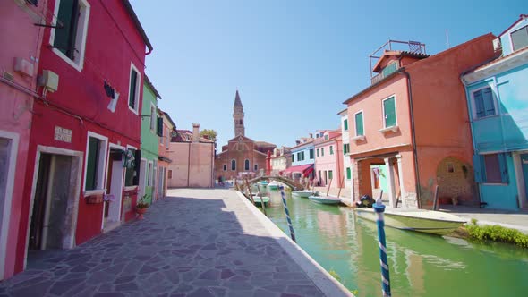 Colorful Houses Stand Along Burano Water Canal Cobbled Road