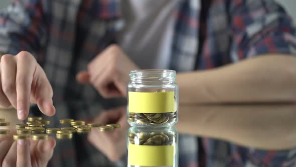 Empty Sticker on Glass Jar With Money, Savings Concept, Investment in Future
