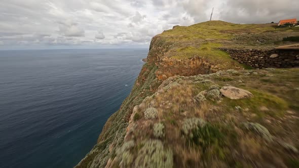 FPV Racing Drone Mountain Surfing and Cliff Diving Along the Rocks