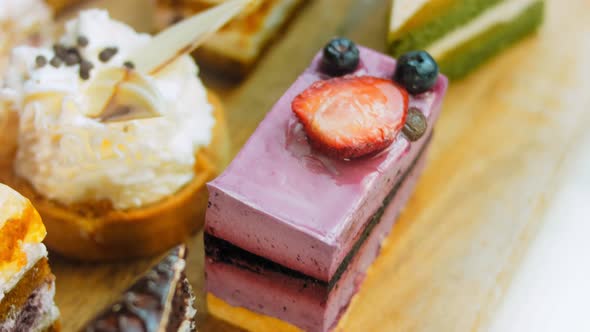 Pieces of Different Cakes on a Retrostyle Baking Tray