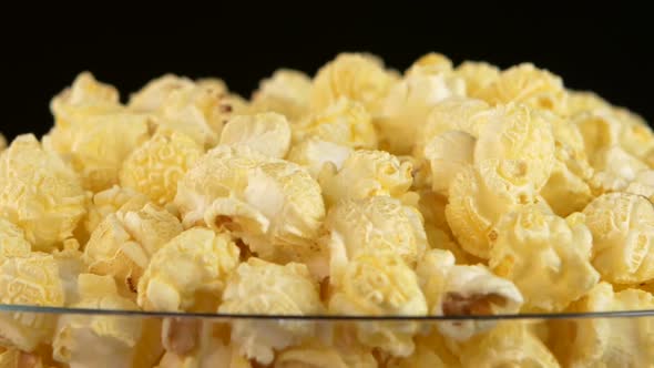 Popcorn in Glass Bowl on Black, Rotation, Close Up