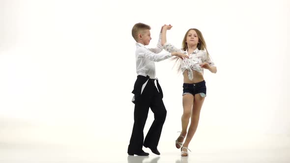 Child Dance Rhythmically Latin American Dance, White Background, Slow Motion