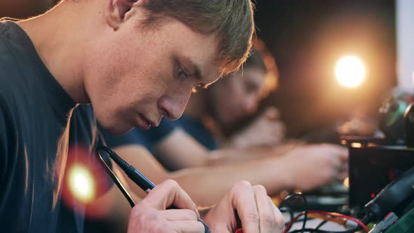 Service Man Soldering Items To Integrated Circuit Soldering Iron