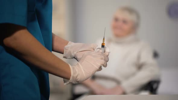 Nurse Making Injection to Elderly Woman, Treatment in Hospital, Health Care