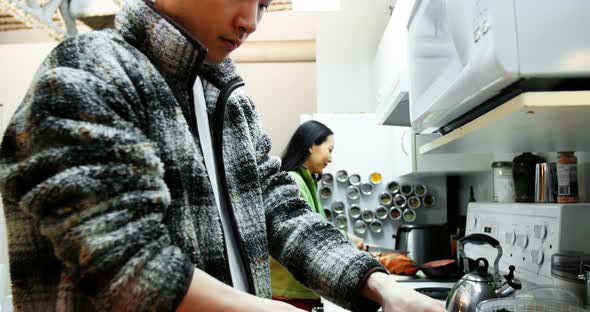 Man chopping vegetables in the kitchen