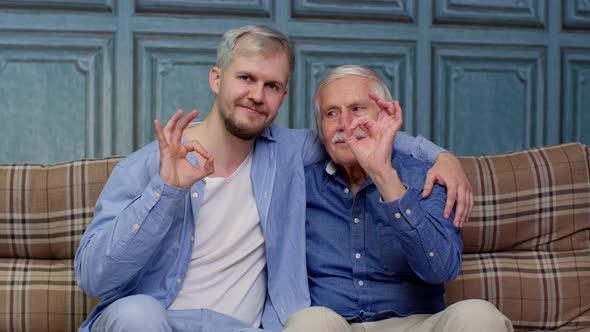 Different Male Generations Family of Senior Father and Adult Son or Grandson Showing Ok Gesture Sign