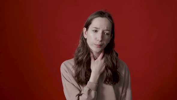 A Young Caucasian Woman Has a Sore Throat