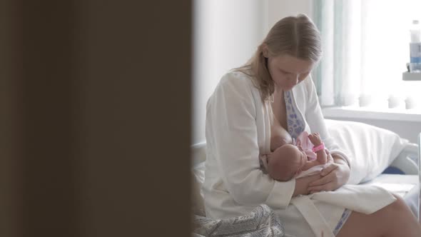 Newborn Baby Being Breastfed By Her Mother